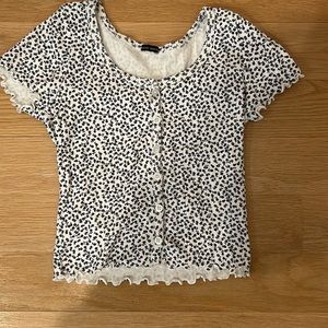 Brandy Melville Navy Blue and White flower print top.